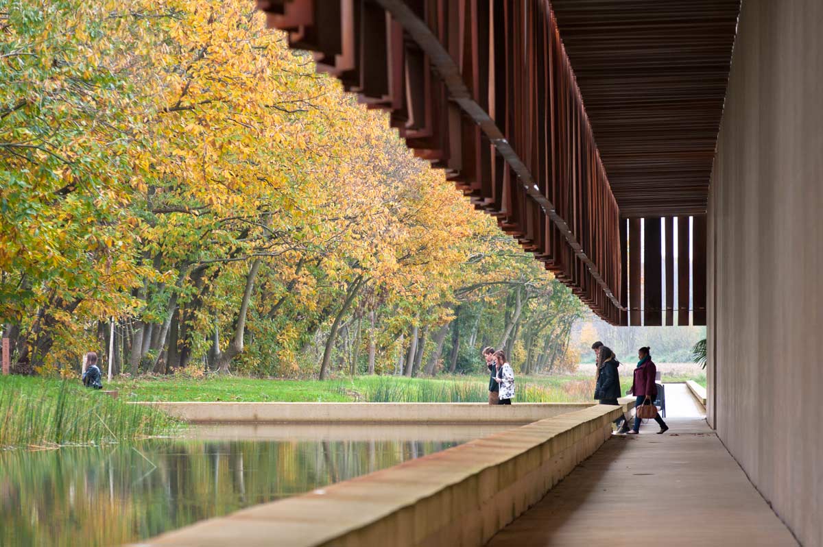 A photo of people walking along the trail next to the Hofheide Crematorium