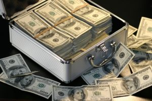 Briefcase overflowing with $100 bills