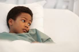 Photo of a child in a hospital bed