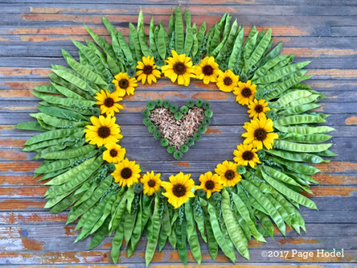 handmade heart of yellow daisies and stems