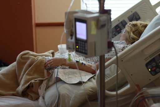 Woman in hospital bed with short life expectancy