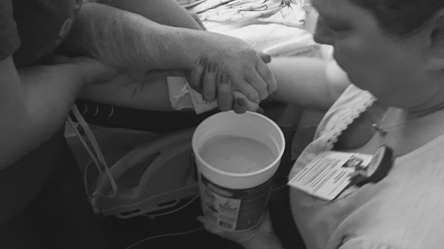 Trish Rogers places hands in gel in the first phase of the process