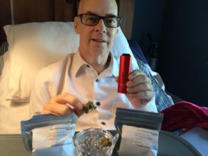 Mark Mooney holding medical cannabis
