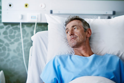 Man alone in a hospital bed