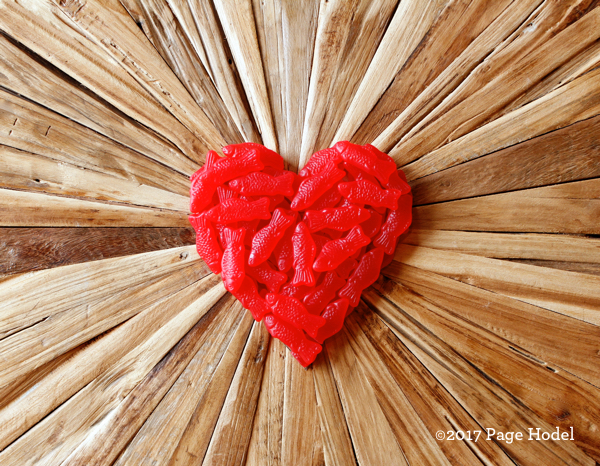 handmade heart made of red fish-shaped candy