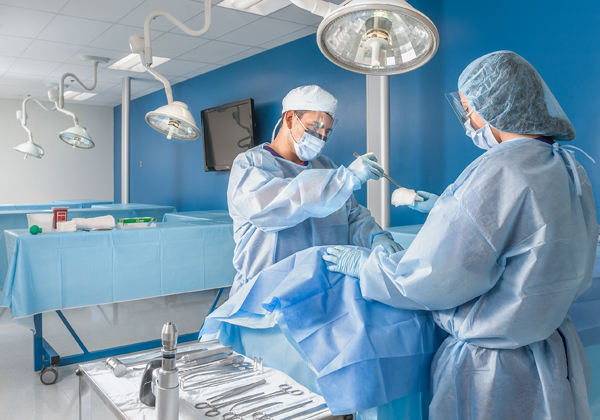 Medical scientists operating on a cadaver