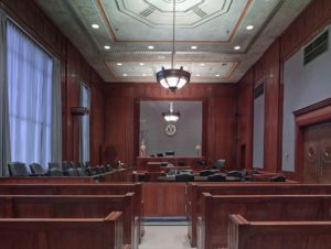 Empty courtroom symbolizing a criminal trial