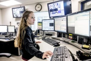 Woman working a police department dispatch system