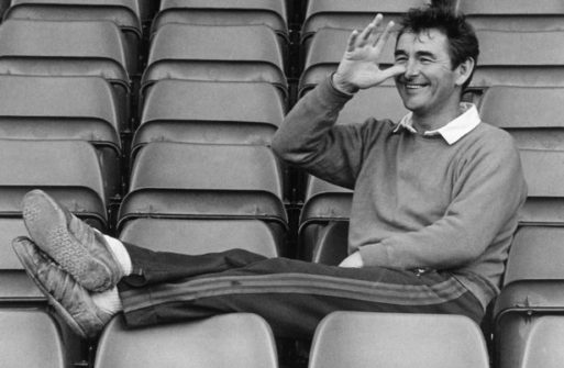Funny portrait of Brian Clough in stadium seats