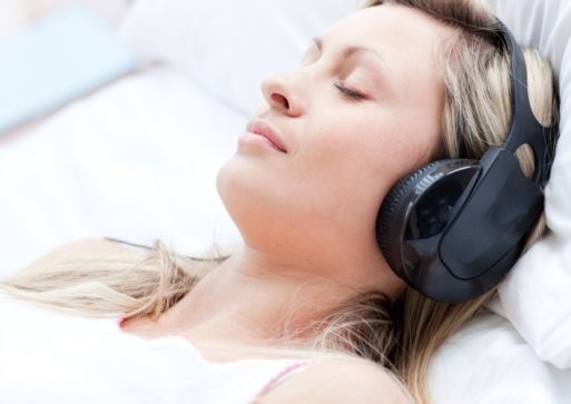 Woman listening to music for self-hypnosis