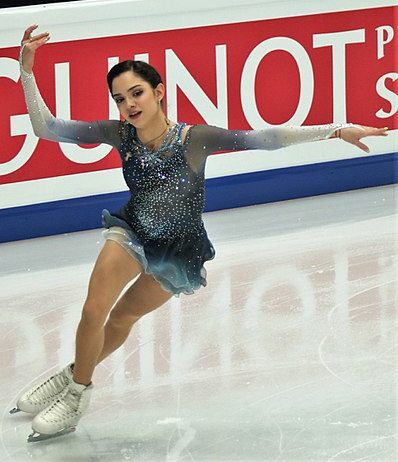 Evgenia Medvedeva skating to her "Clinical Death" figure skating routine while wearing a blue and white dress