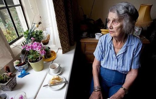 Elderly woman staring out the window is predicposed to self-neglect