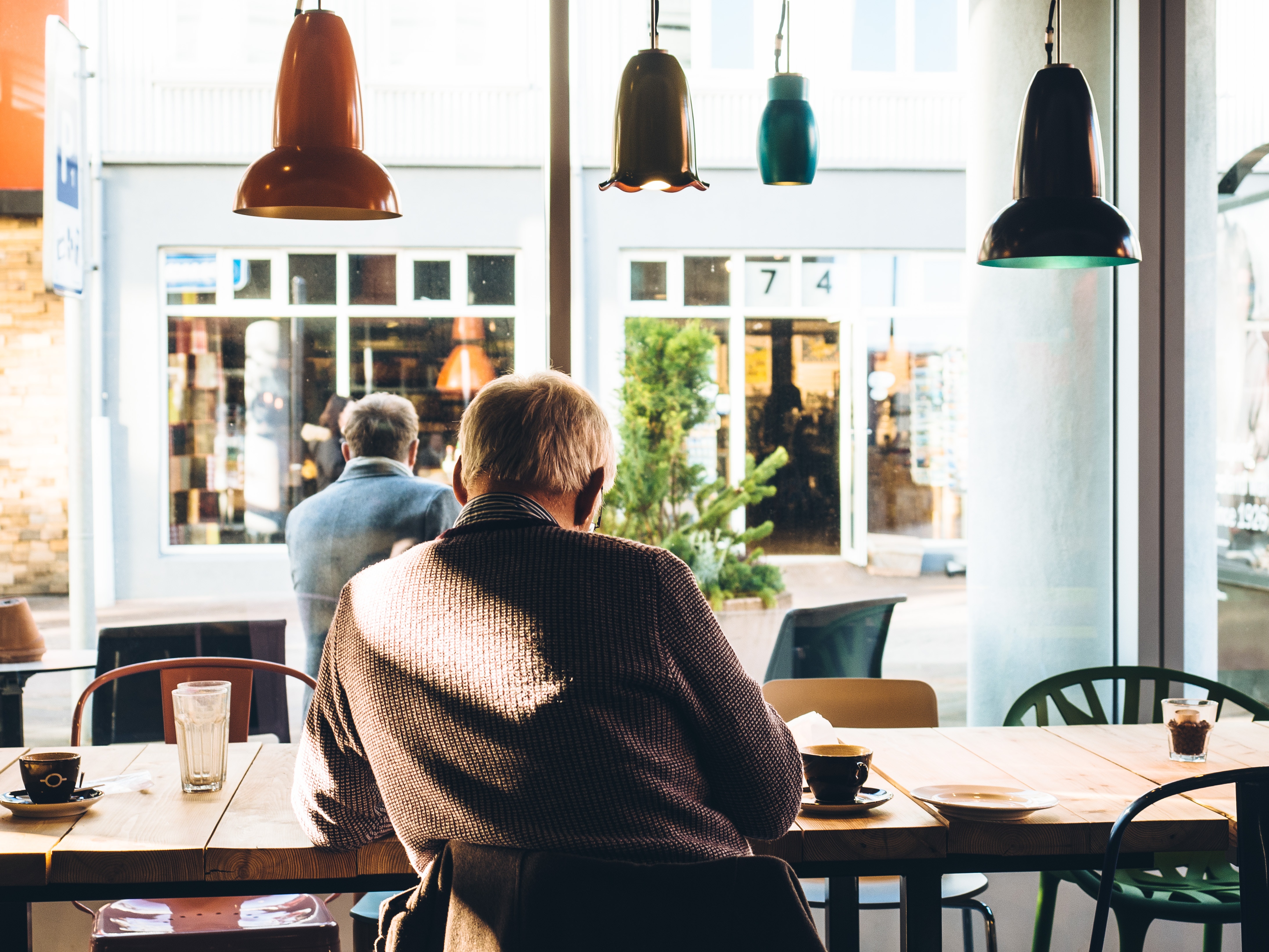 Image of elderly man's back as he considers life expectancy and retirement