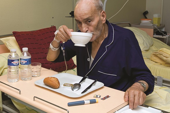 Man sho suffers from self-neglect eating and getting IV fluids in hospital