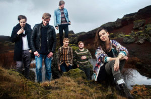 Photo of the band Of Monsters And Men posing outdoors.