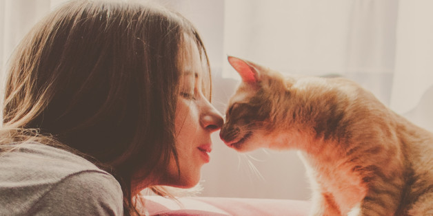 A woman connects with her cat