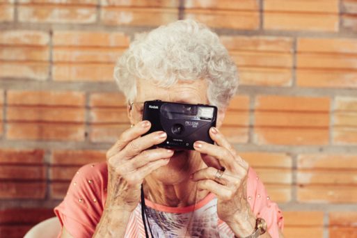 Image of elderly woman with camera