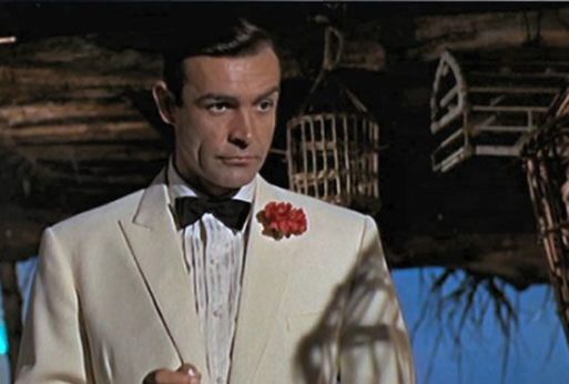 James Bond wearing a flower in his buttonhole