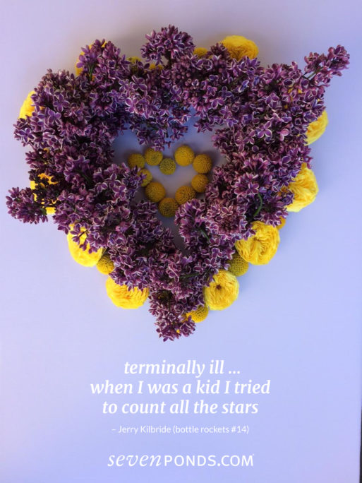 A heart made of flowers with a haiku about death
