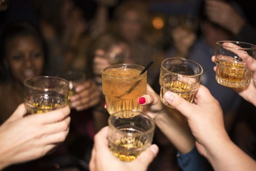 Young people raising glasses filled with alcohol leading to deaths from liver disease