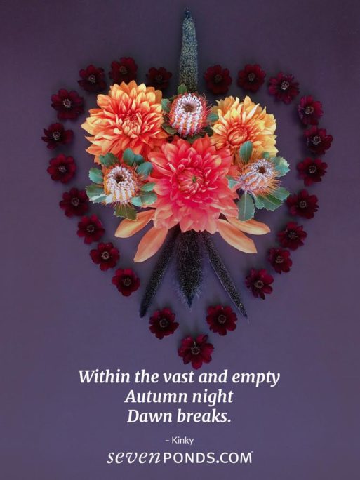 handmade heart of yellow, orange and red flowers on purple background with death haiku