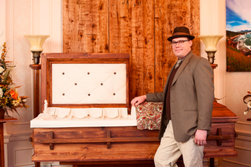 Jonas Zahn displays a green casket interior at his Northwoods Casket Company