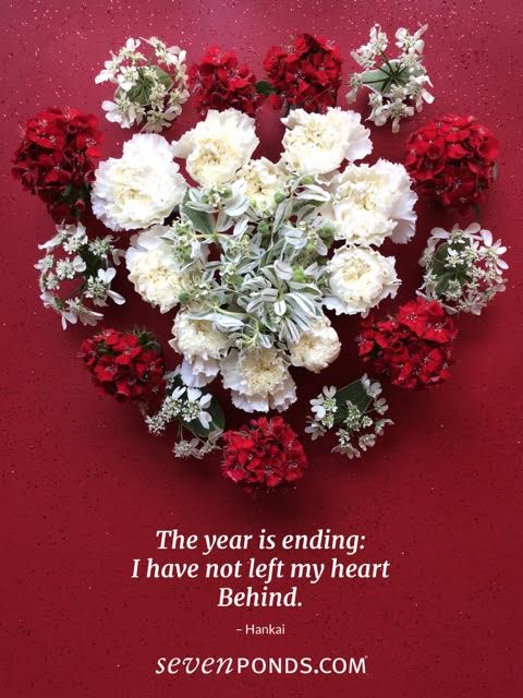 heart made of flowers with a haiku about death