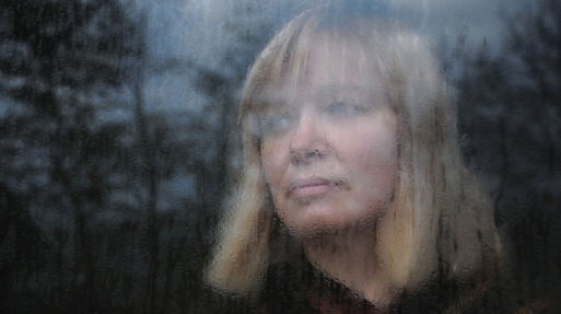 woman in window let me grieve but not forever