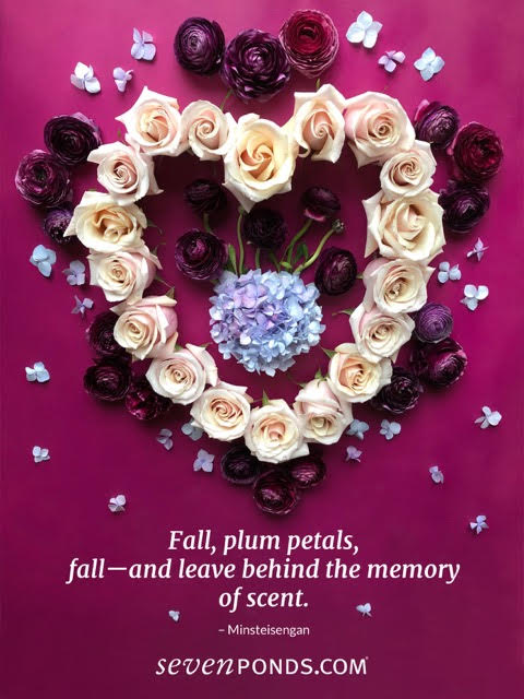 A haiku and handmade heart of flowers on a pink background