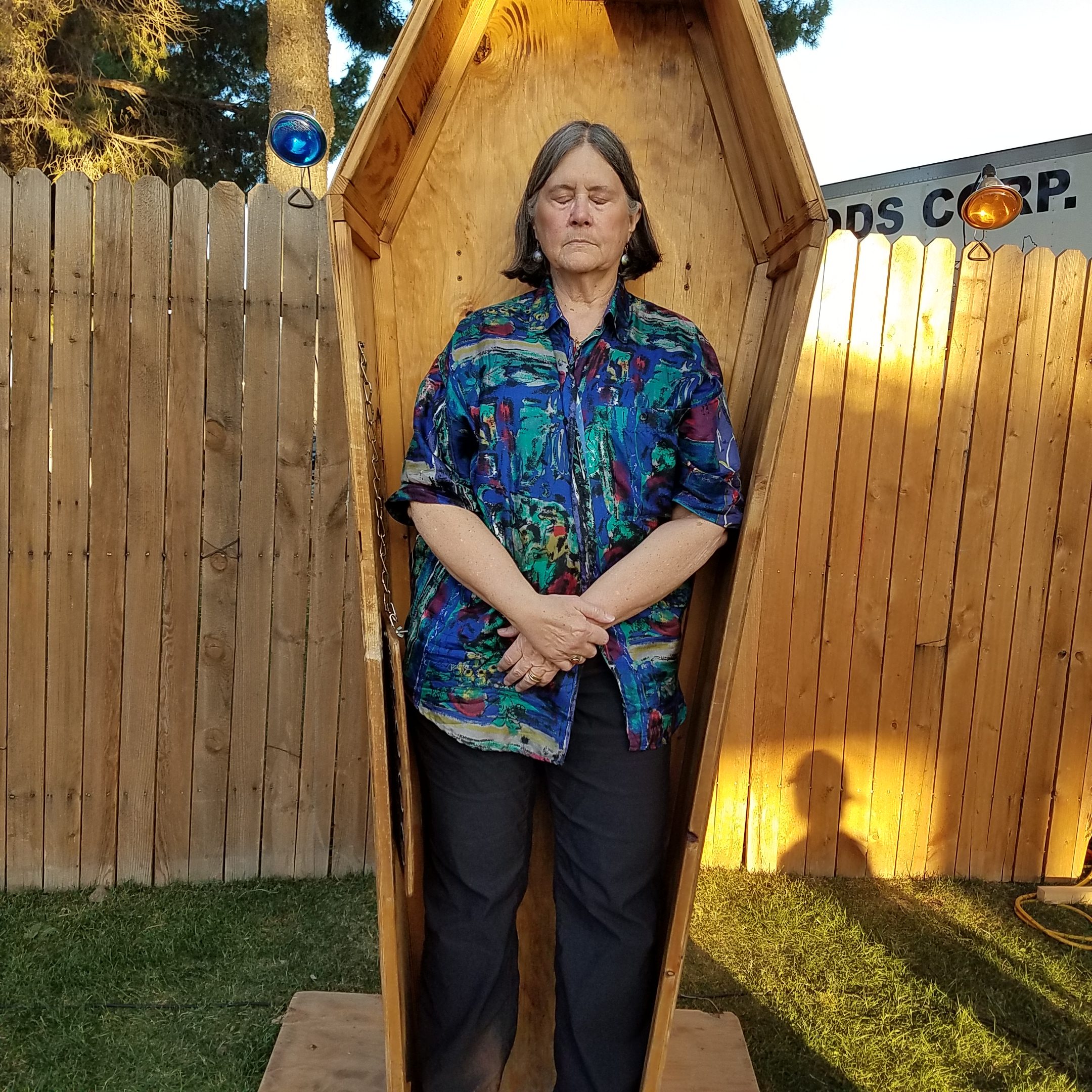 Ruth Bennett standing in a casket