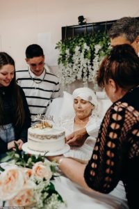 Tracey MacDonald and her family cutting cake on her wedding day shortly before her death from lung cancer