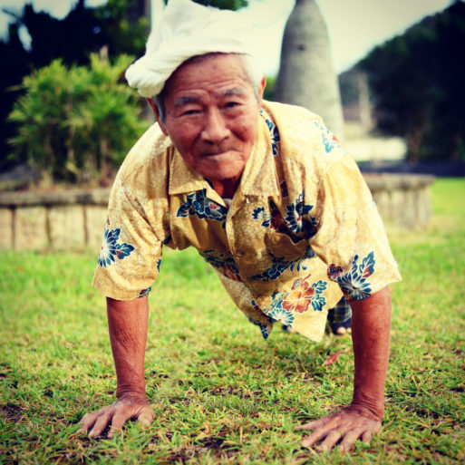 Elderly Japanese man in Okinawa performing a push-up
