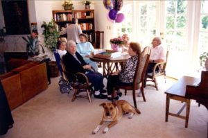 Group of seniors in a board-and-care-home living room.