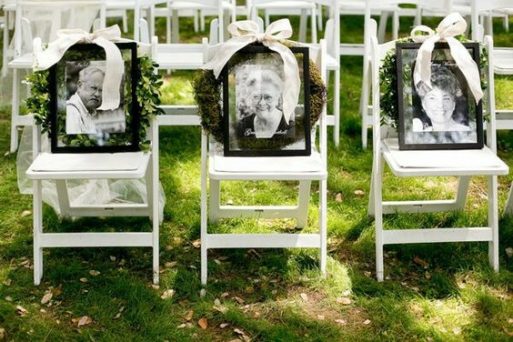 Seating at wedding with portraits to honor a deceased parent at a wedding