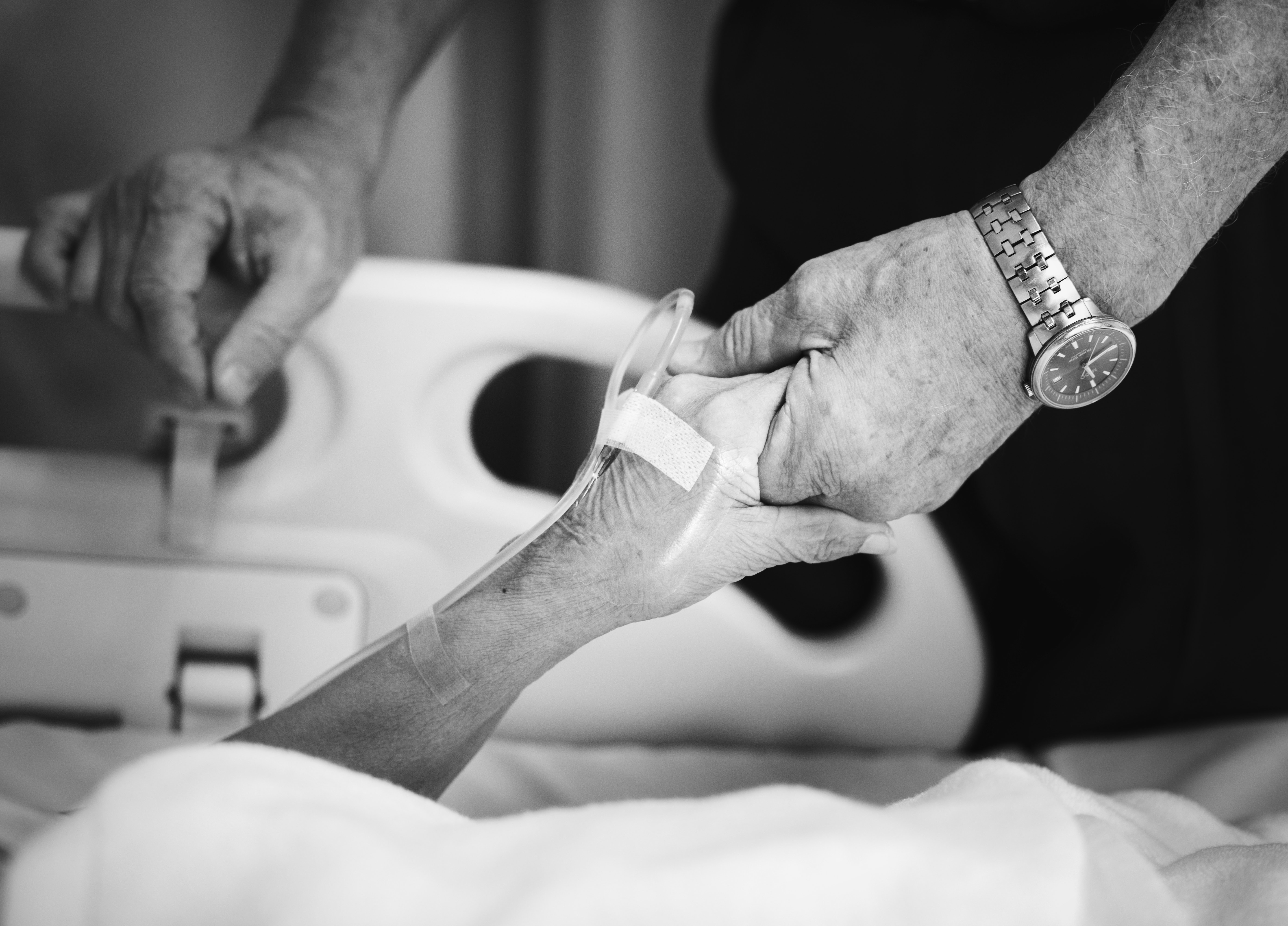 Image of hands in a hospital bed representing generic drug conspiracy