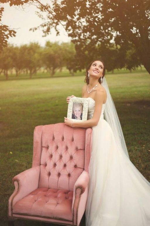 Bride at wing chair honoring her deceased parent at her wedding