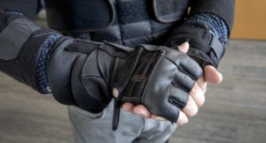 Man wearing the wrist and glove attachments of a GERT suit.