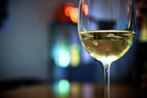 A half full glass of wine reflects Anne Lamott's philosophy