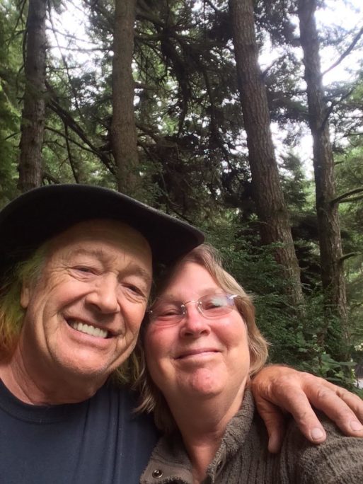A man and his wife in the redwoods of California seeking awareness of death