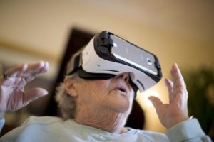 Elderly woman using a virtual reality headset.