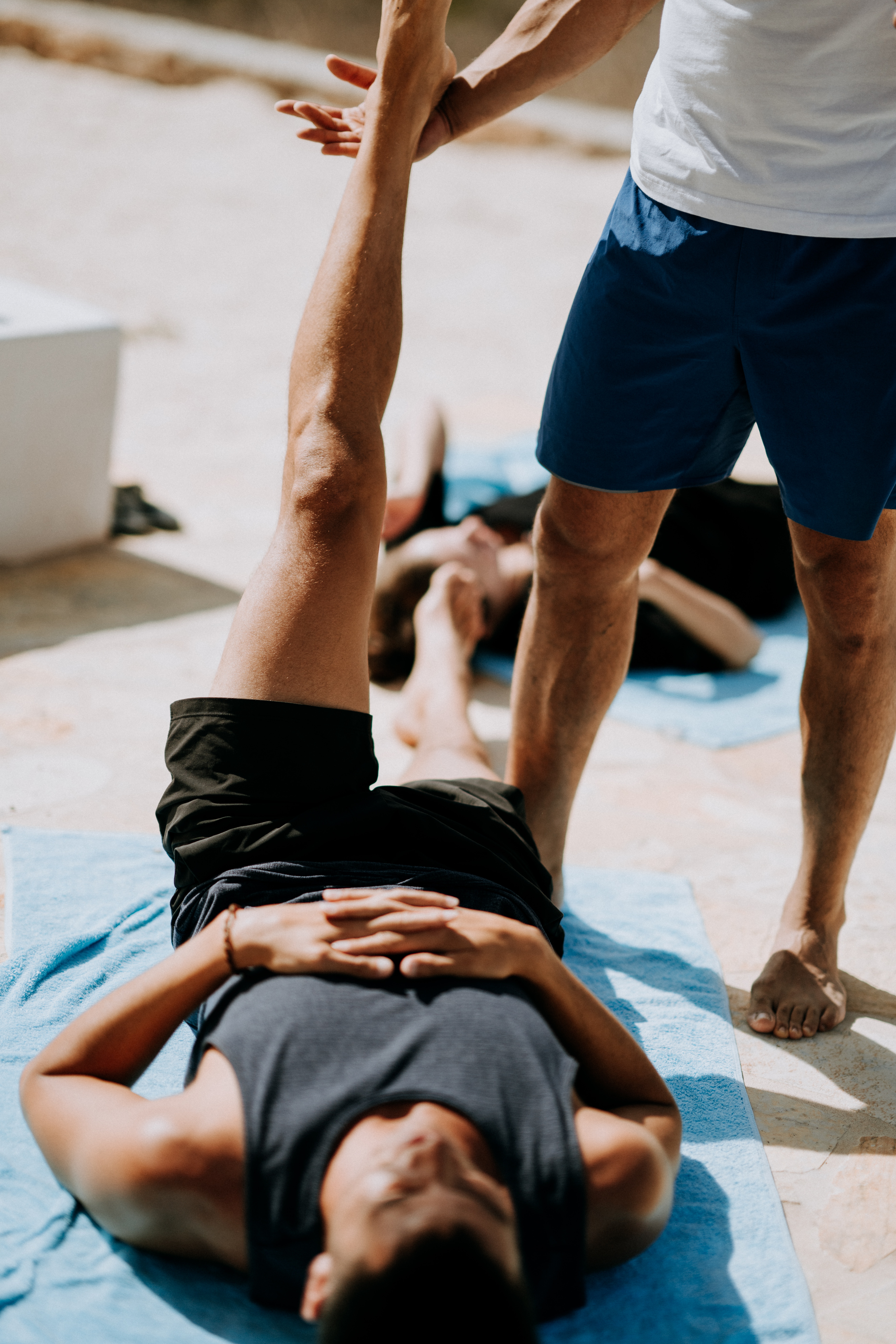 A person on the floor exercising to improve brain health