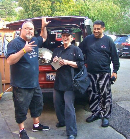 Gerontologist Elizabeth Sutherland with Sean Saylor and his head chef at a catering event.