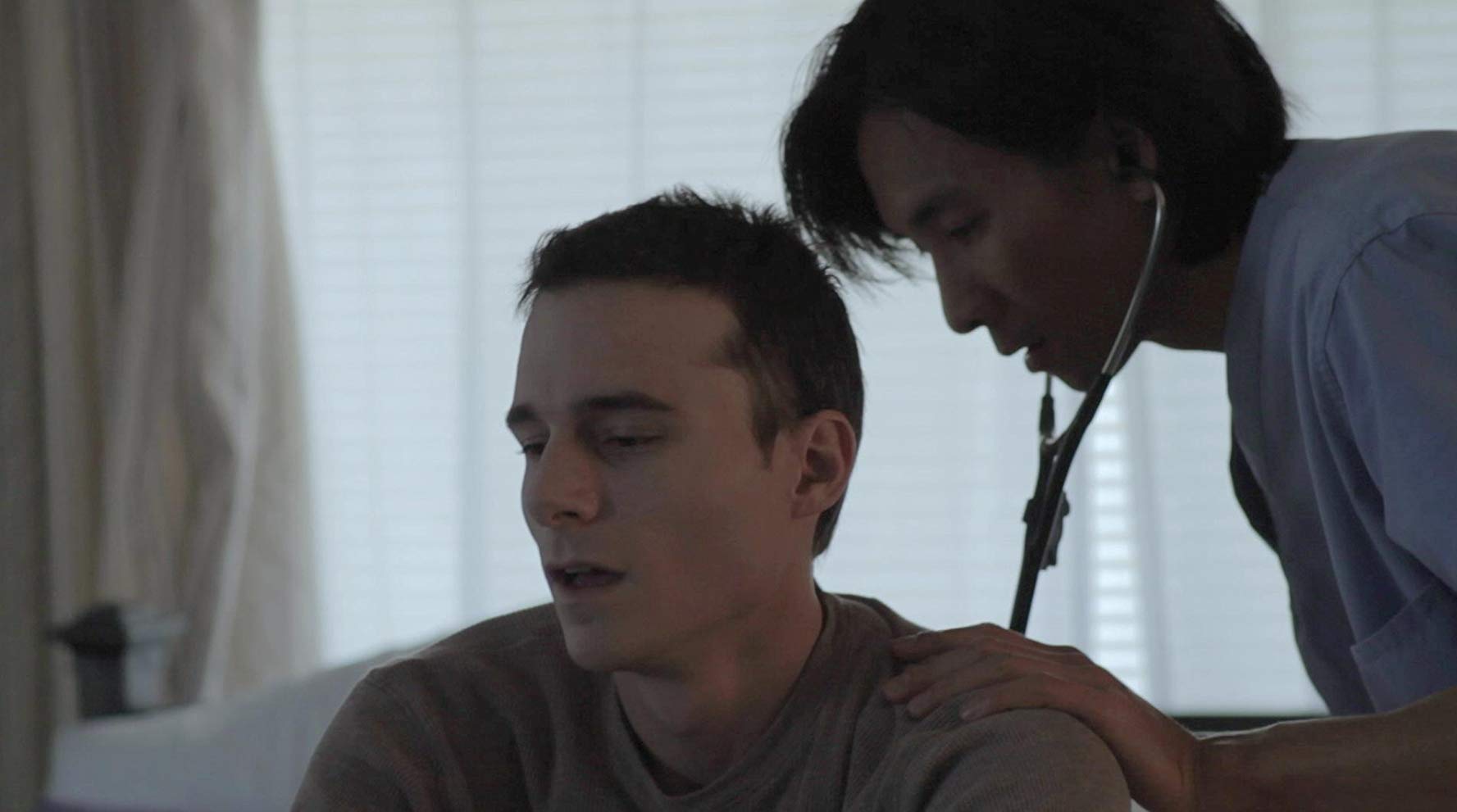 Scene from "After the Rain" in which the main character is being checked on by a nurse.