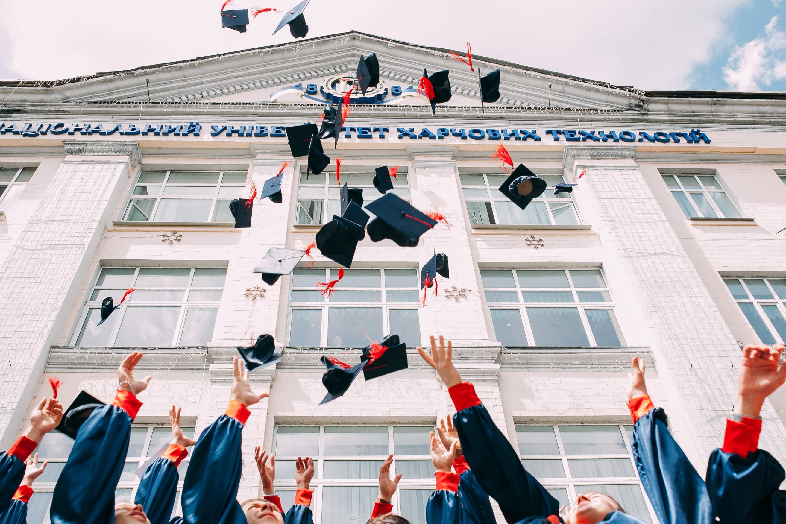 Kids throwing their hats at graduation celebrate the generosity of Dale Schroeder