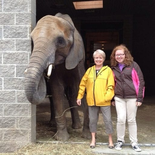 Jill Kearney, founder and CEO of Senior Moves By Design, with her daughter and an elephant.