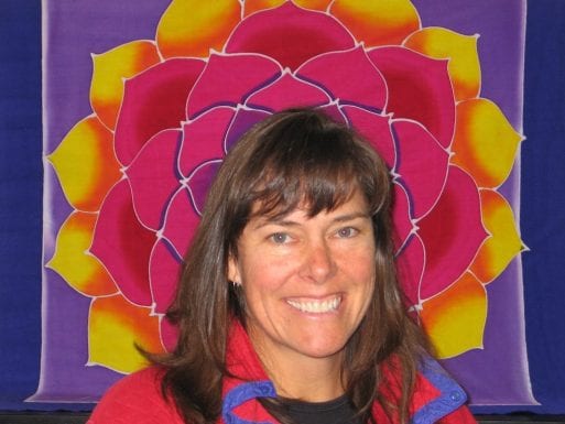 Cari smiling in front of a lotus flower before her death