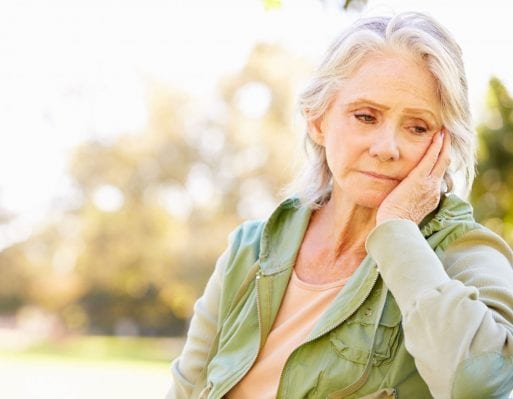 Suffering older woman in chronic pain 