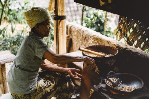 An elderly poor woman living in a hut benefits from Unbound