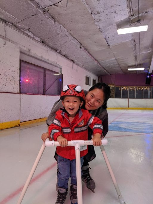 Emily Kil of Eco Bear ice skating with her son.
