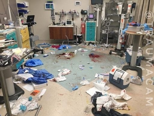 A hospital room where everything is strewn about after a traumatic Code Blue.